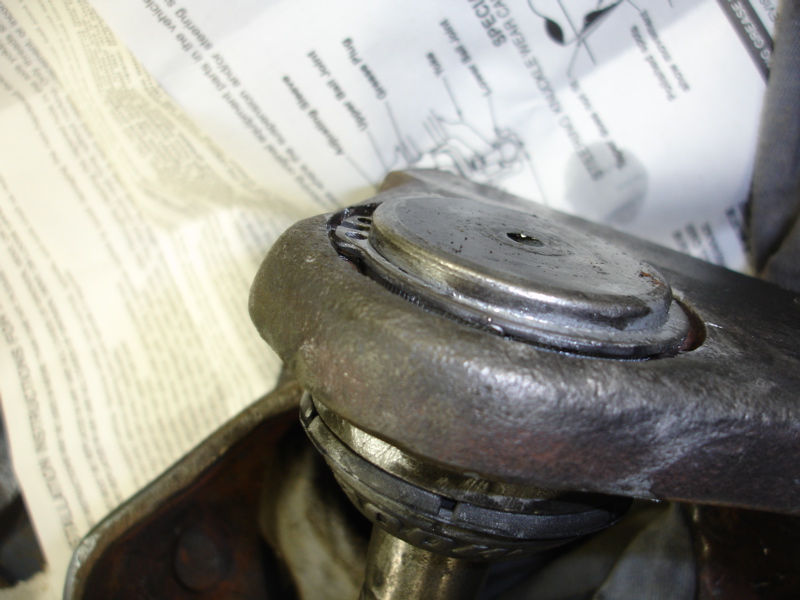 Ball joint assembly with diagram showing grease plug and adjusting sleeve