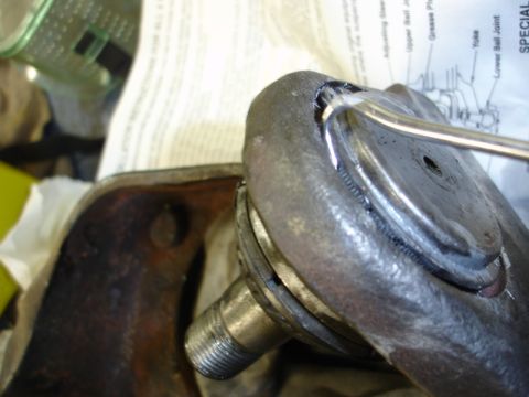 1996 Ford Bronco - Automotive ball joint repair in progress, with a technical diagram visible.