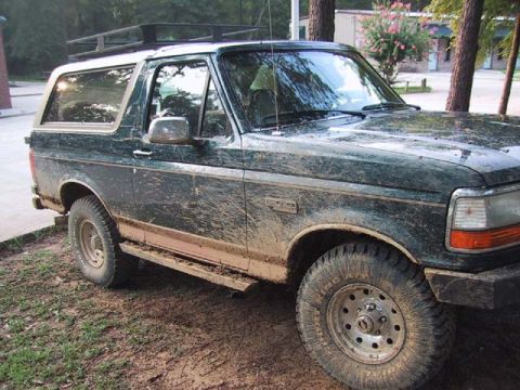 1995 Ford Bronco - This 1995 Ford Bronco is covered in mud, suggesting it has been off-roading.