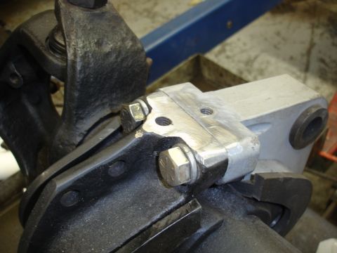 1996 Ford Bronco - A detailed view of vehicle suspension parts, showing bolted metal components and brackets.