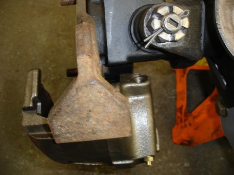 1996 Ford Bronco - Close-up view of a brake caliper and rotor assembly, showing a cotter pin securing a castle nut.