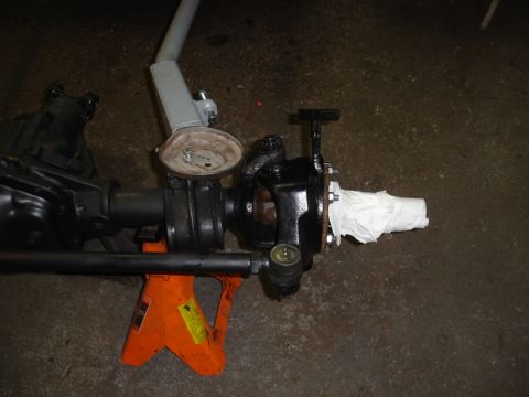 1996 Ford Bronco - Front axle assembly on jack stands, ready for work or storage.