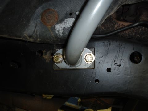 1996 Ford Bronco - This is a close-up view of an anti-roll bar mounting bracket attached to the vehicle's frame.