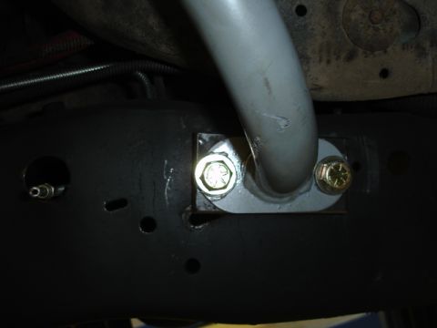 1996 Ford Bronco - This photo shows a close-up view of a sway bar mount attached to the frame of a vehicle.