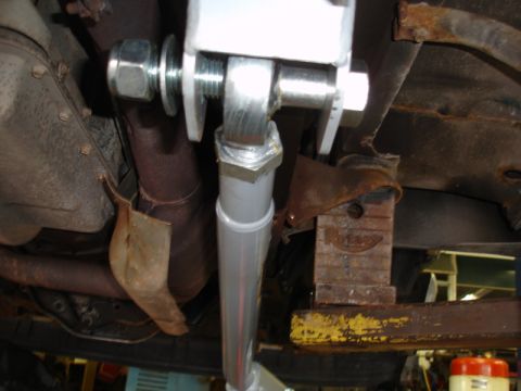 1996 Ford Bronco - Close-up of rusty underbody suspension parts and exhaust pipe.