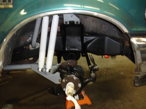 1996 Ford Bronco - Front suspension components of a 1996 Ford Bronco, including shocks and steering linkage.
