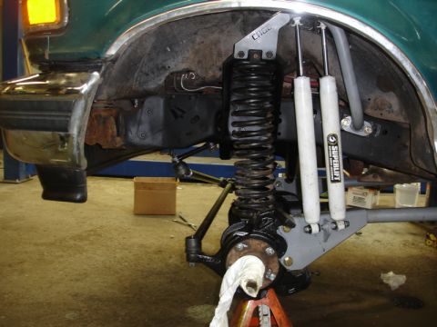 1996 Ford Bronco - Front suspension of a 1996 Ford Bronco undergoing modifications with new Superlift shocks.