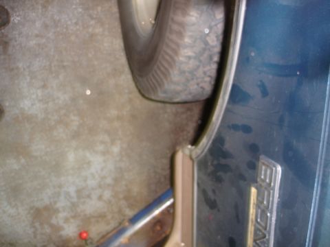 1996 Ford Bronco - The 'BRONCO' emblem is clearly visible on the dark blue body panel of this 1996 Ford Bronco.