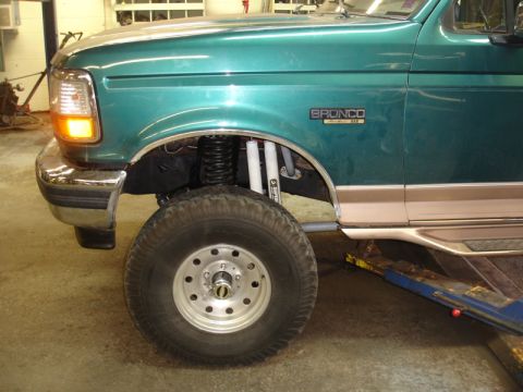 1996 Ford Bronco - Close-up of the front fender and wheel assembly on a 1996 Ford Bronco.