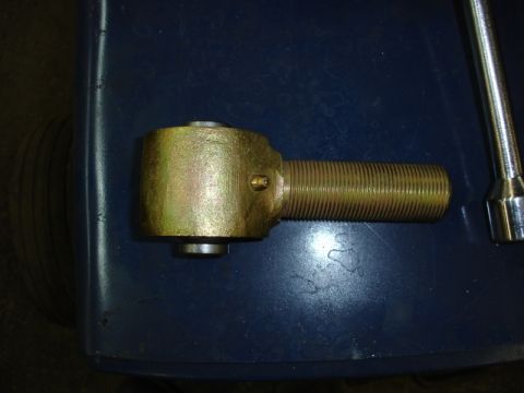 1996 Ford Bronco - A close-up view of a single automotive tie rod end part.