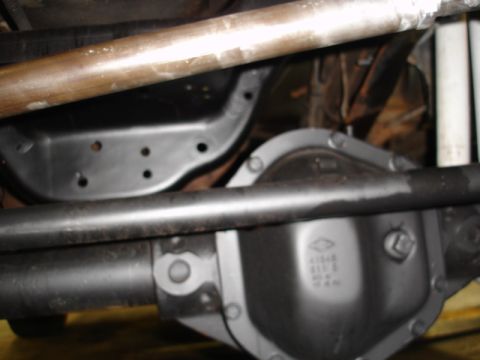 1996 Ford Bronco - Close-up of a vehicle's differential housing and suspension components.