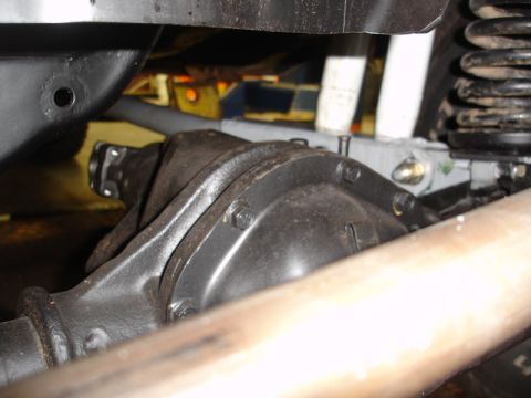 1996 Ford Bronco - Close-up view of a vehicle's rear differential and suspension system.