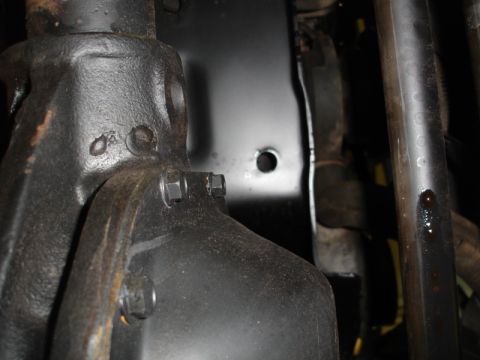 1996 Ford Bronco - Detail shot of the vehicle's undercarriage, focusing on suspension and drivetrain components.