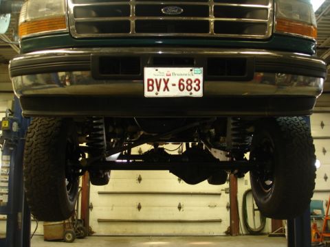 1996 Ford Bronco - This truck's front end is captured in a close-up shot, revealing its grille and license plate.