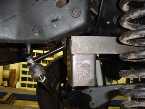 1996 Ford Bronco - Undercarriage view showing suspension components and steering linkage, possibly modified.