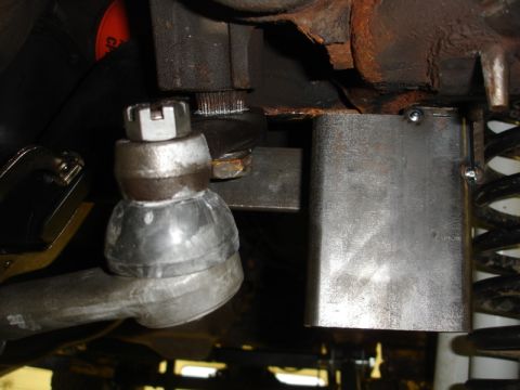 1996 Ford Bronco - Undercarriage view showing steering linkage and suspension parts, possibly modified.