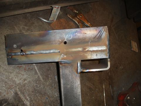 1996 Ford Bronco - Metal bracket with visible welds and holes, likely a custom fabrication.