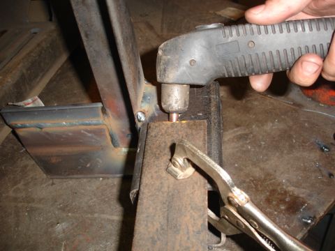 1996 Ford Bronco - Metal fabrication in progress with a plasma cutter and clamps.