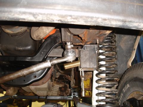 1996 Ford Bronco - Close-up view of the undercarriage, focusing on the suspension system and steering components.