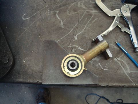 1996 Ford Bronco - A close-up view of a single automotive suspension component on a metal surface.