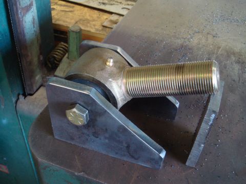 1996 Ford Bronco - A close-up view of a metal rod end joint with a threaded shaft, likely a custom automotive part.