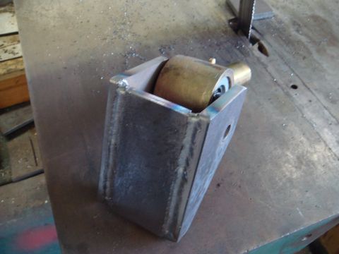 1996 Ford Bronco - Custom metal bracket with a roller mechanism, likely for a gate or door.