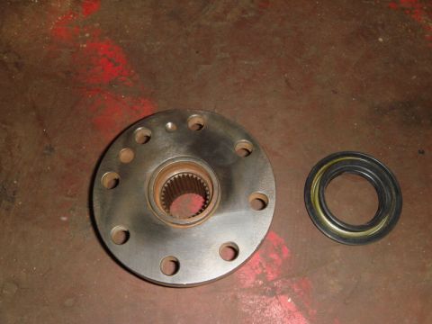 1996 Ford Bronco - A wheel hub assembly and a rubber seal are shown, likely for a vehicle's drivetrain.