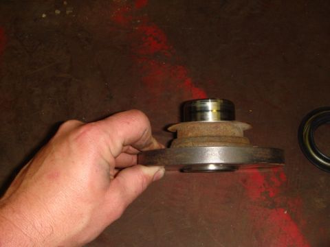 1996 Ford Bronco - A close-up view of a vehicle's wheel bearing and seal, likely for replacement.