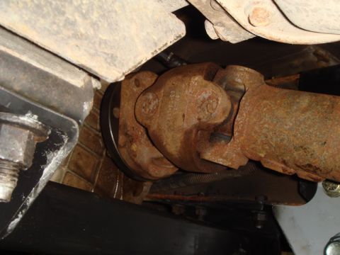 1996 Ford Bronco - Close-up view of a rusty driveshaft universal joint, likely from a vehicle's undercarriage.