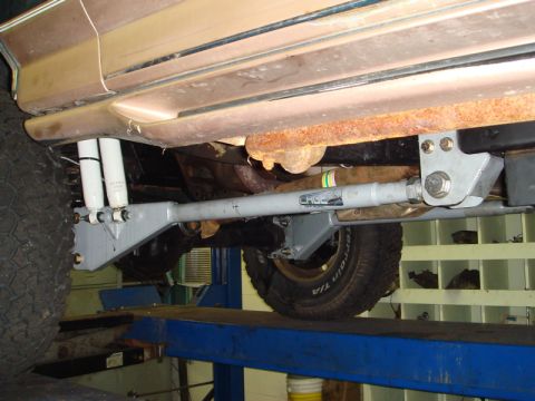 1996 Ford Bronco - Aftermarket suspension components installed on a vehicle's underbody.