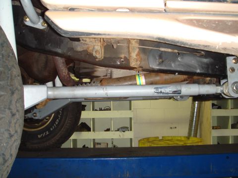 1996 Ford Bronco - Undercarriage view of a vehicle, highlighting suspension modifications and the frame structure.