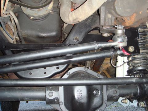 1996 Ford Bronco - Undercarriage view shows steering and suspension parts, with visible part numbers on the differential cover.