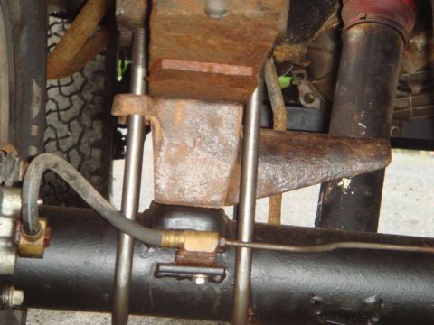 1996 Ford Bronco - Rusty rear axle and suspension parts are visible in this close-up shot.