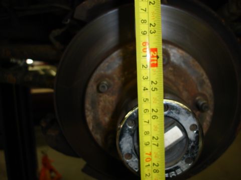 1996 Ford Bronco - Measuring the hub and rotor assembly of a vehicle.