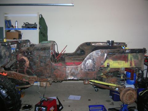 1986 Ford Bronco - This Jeep CJ-7 body and chassis is in a state of restoration, with visible rust and exposed components.