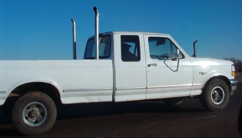 1983 Ford Bronco - I'm sure the stacks add at least 10hp each, but I wonder what the deer leg does for the radio reception...