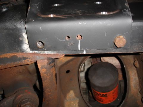 1996 Ford Bronco - This image shows a close-up view of a vehicle's undercarriage, focusing on the frame and an oil filter.