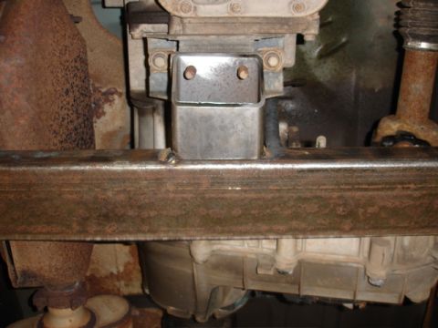 1996 Ford Bronco - Close-up of a vehicle's undercarriage, focusing on the transmission and exhaust components.