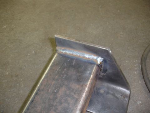 1996 Ford Bronco - A metal bracket shows a freshly welded seam, indicating recent fabrication or repair.
