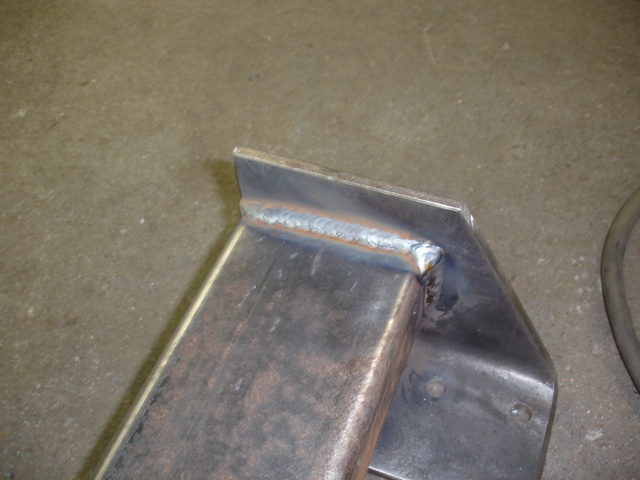 Close-up of a metal bracket with a visible weld seam