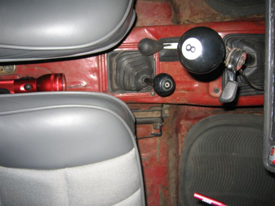 Interior view with dual gear shifters and an 8-ball shift knob