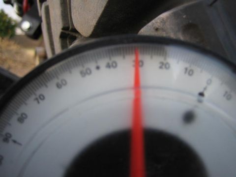 1987 Suzuki Samurai - Close-up of a gauge with a red needle indicating a reading of 30.