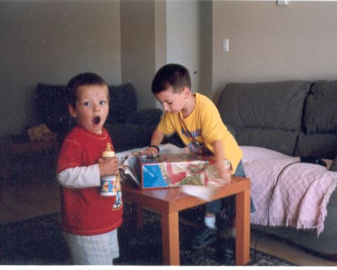 1989 Ford Bronco - A surprise moment as a child opens a gift while his brother looks on.