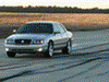 2001 Mercury Grand Marquis - A silver 2001 Mercury Grand Marquis is shown from the front-right quarter angle on a paved surface.
