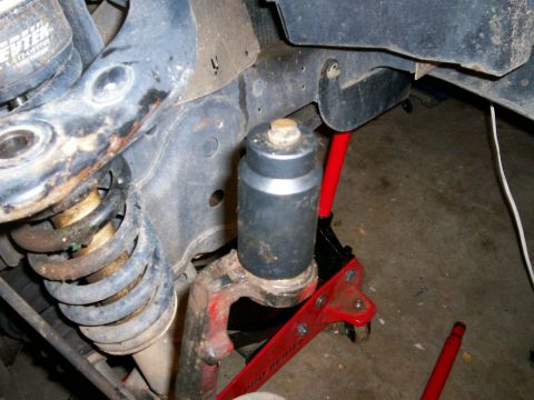 1993 Ford Bronco - Prepping upper bj to be pressed out of knuckle using 36 mm socket with bolt on top