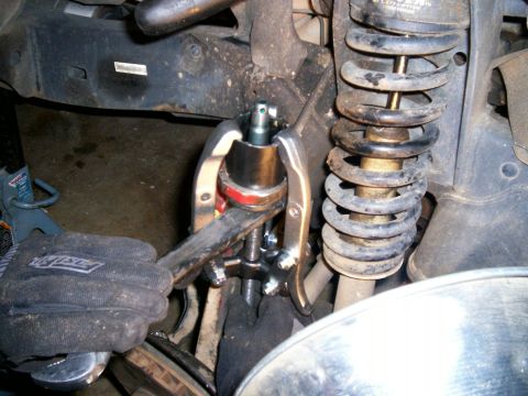 1993 Ford Bronco - Using a big wrench under bj to help press new bj in more evenly and to prevent stud from puncturing it