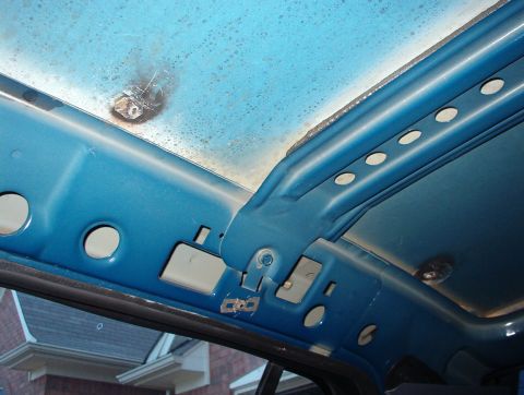 1999 Ford Crown Victoria - RHR welded patches, & roof bows used only in P71s. They're bolted & glued in, and they interfere with civilian headliners.