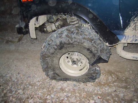 1995 Ford Bronco - Alex's tire carnage---It's only a $300 new tire.
