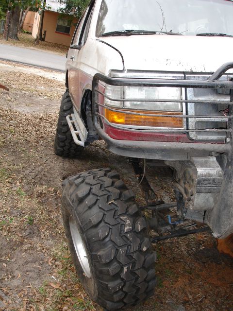 1989 Ford Bronco - Front view of a modified 1989 Ford Bronco with oversized tires and a custom bumper.