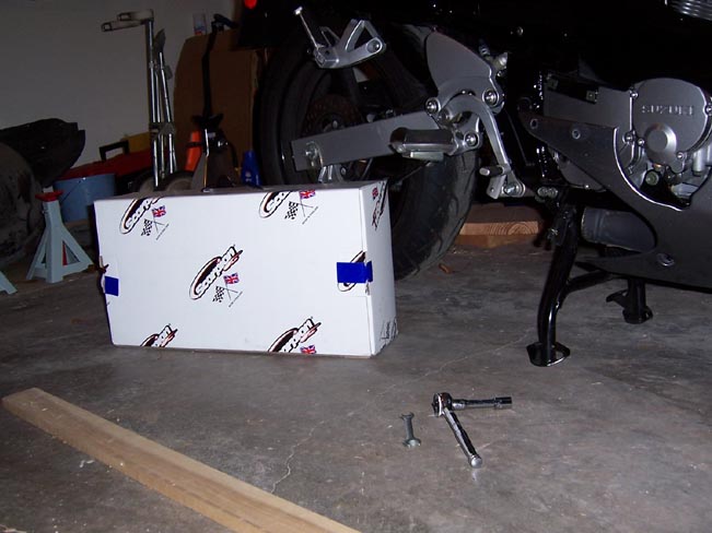 Suzuki motorcycle engine and rear wheel with a box of parts